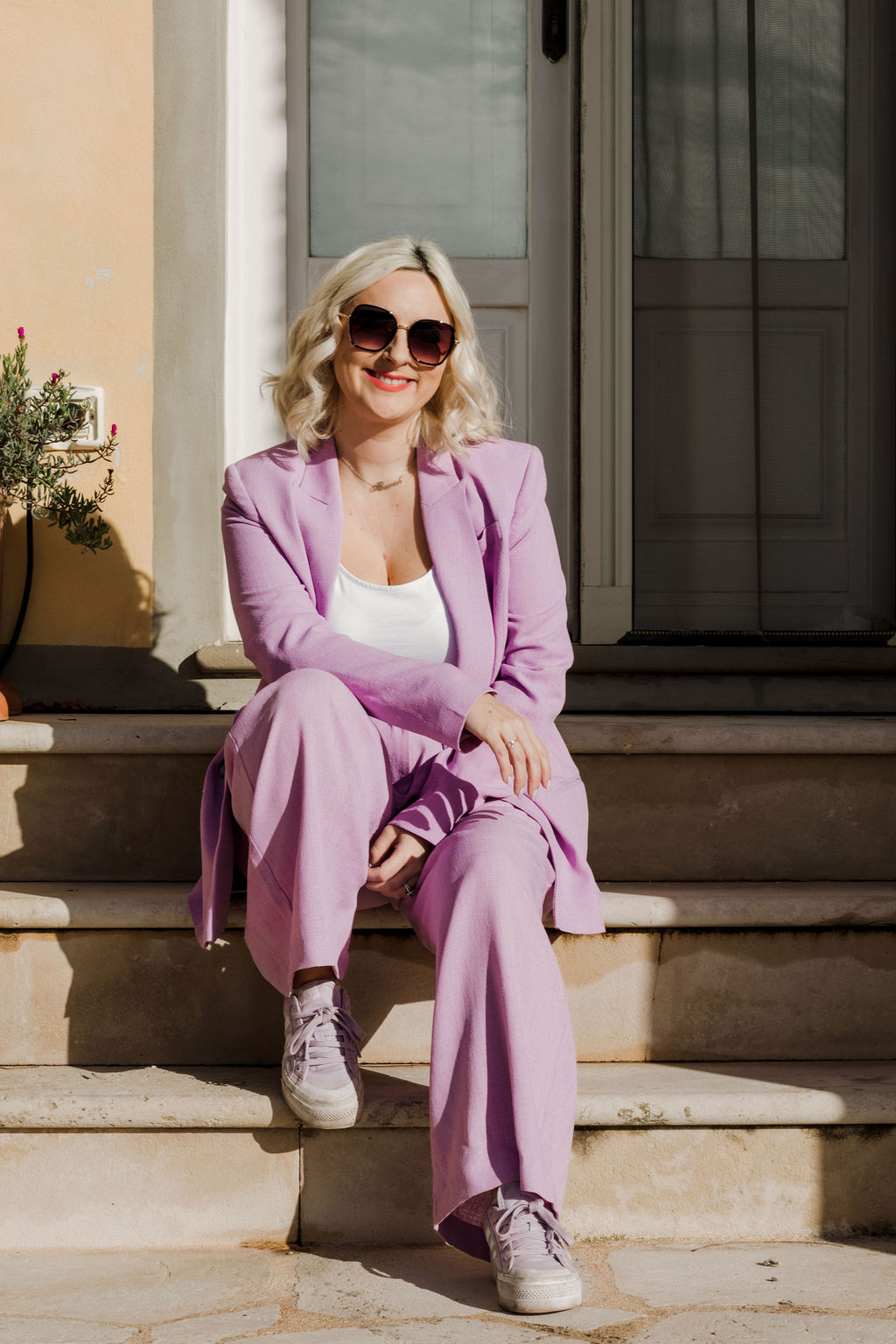 Holly Wood The Flourish Mentor sitting on stairs in Tuscan Retreat