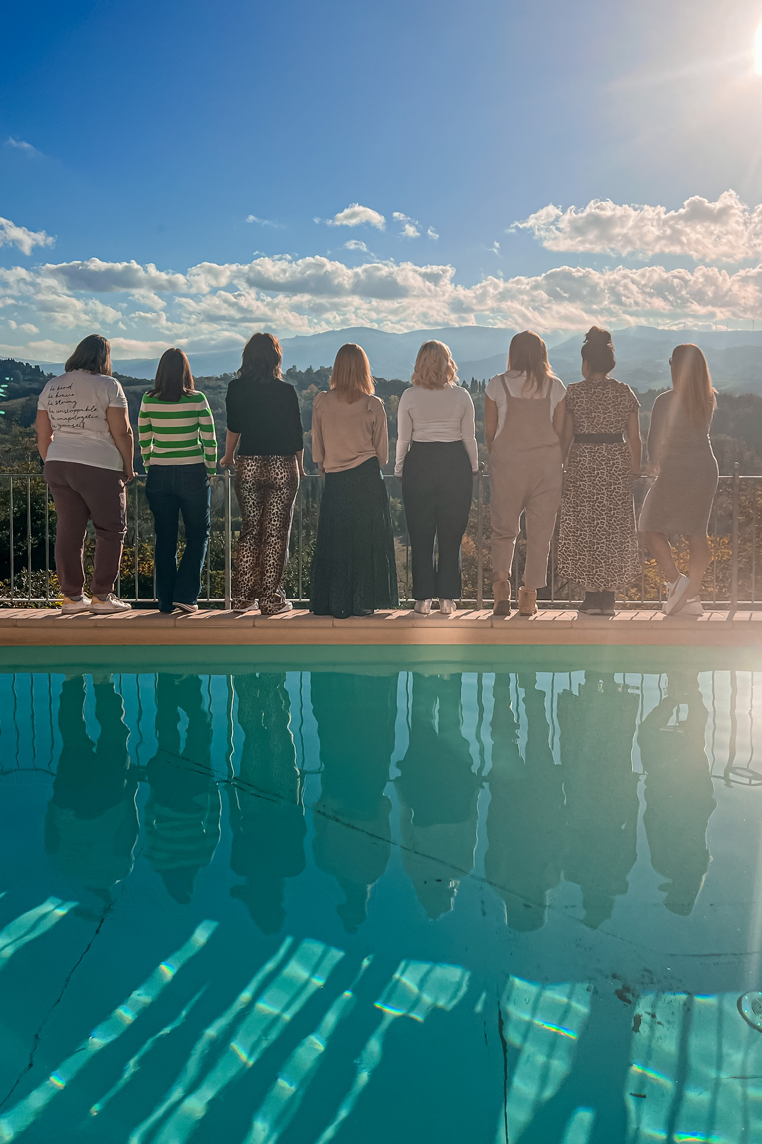 flourish business retreat attendees standing by pool